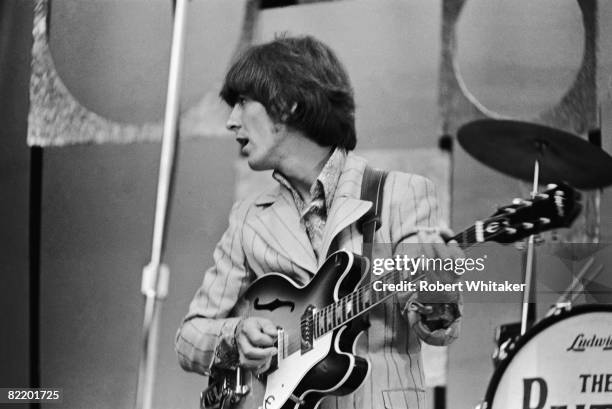 George Harrison performing with the Beatles at the Rizal Memorial Football Stadium, Manila, Philippines, during the group's final world tour, 4th...