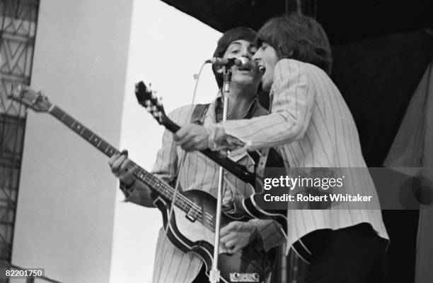 Paul McCartney and George Harrison performing with the Beatles at the Rizal Memorial Football Stadium, Manila, Philippines, during the group's final...