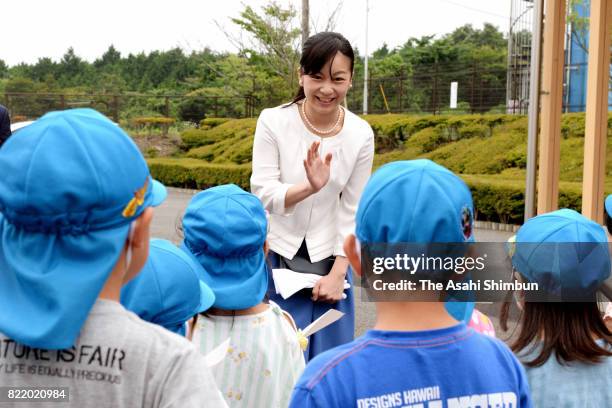 Princess Kako of Akishino waves to kindergarten children on arrival at the 51st All Japan High School Equestrian Championships at the Gotemba City...