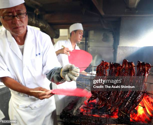 Chefs grill eels on July 25, 2017 in Nagoya, Aichi, Japan. It is said that people eat eel on the Doyo-no-Ushi-no-Hi, July 25 this year, day of the ox...