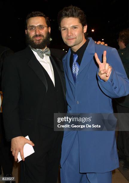 Rabbi Shmuley Boteach and actor Corey Feldman pose for photographers as they attend the 16th annual Rock and Roll Hall of Fame awards dinner March...