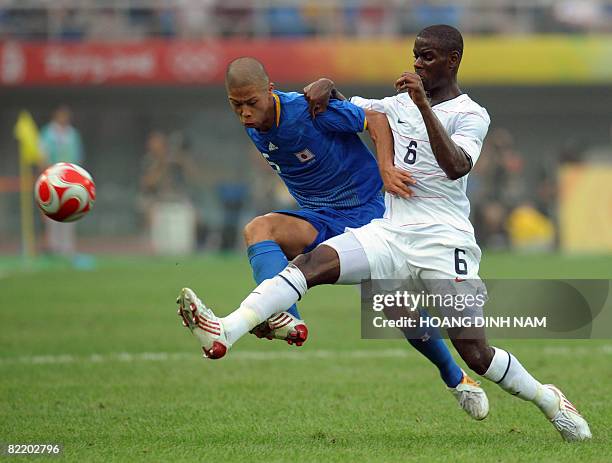 Maurice Edu of US vies for the ball with Japan's Takuya Honda during their 2008 Beijing Olympic Games first round group B Men's football match at the...