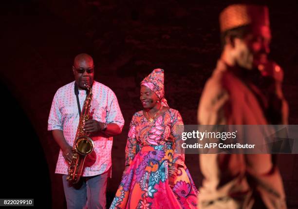 Cameroonian-French saxophonist Manu Dibango, Beninese singer Angelique Kidjo and Ivorian actor Isaac de Bankole perform during a rehearsal of the...