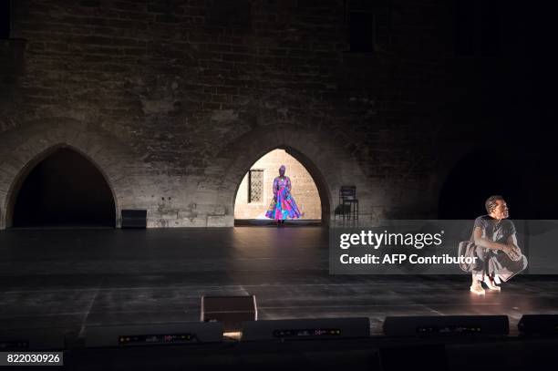 Ivorian actor Isaac de Bankole and Beninese singer Angelique Kidjo perform during a rehearsal of 'Femme Noire' on July 24, 2017 at the "Cour...