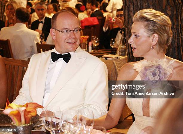 Prince Albert II of Monaco and Charlene Wittstock attend the 60th Monaco Red Cross Ball at the Monte-Carlo Sporting Club on August 1, 2008 in Monte...