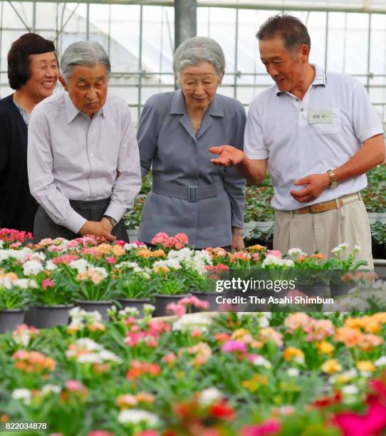 Emperor Akihito and Empress Michiko visit a flower farmer near the Nasu Imperial Villa on July 24, 2017 in Nasushiobara, Tochigi, Japan.