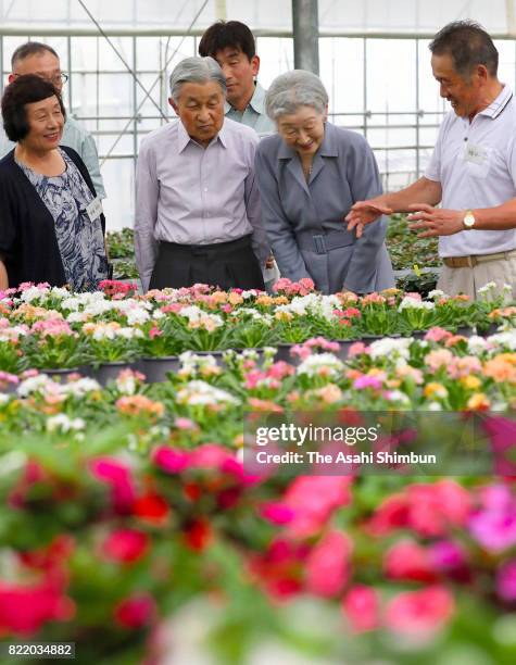 Emperor Akihito and Empress Michiko visit a flower farmer near the Nasu Imperial Villa on July 24, 2017 in Nasushiobara, Tochigi, Japan.