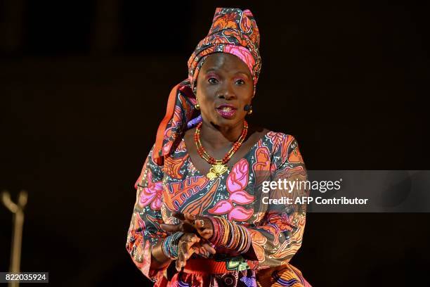 Beninese singer and actress Angelique Kidjo performs during a rehearsal of 'Femme Noire' on July 24, 2017 at the "Cour d'Honneur du Palais des Papes"...