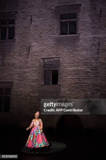 Beninese singer and actress Angelique Kidjo performs during a rehearsal of 'Femme Noire' on July 24, 2017 at the "Cour d'Honneur du Palais des Papes"...