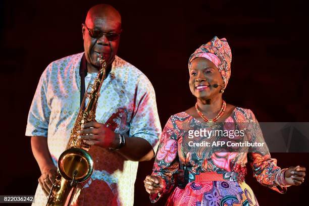 Beninese singer and actress Angelique Kidjo and Cameroonian-French saxophonist Manu Dibango perform during a rehearsal of 'Femme Noire' on July 24,...