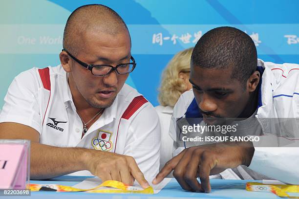 Japan judoka Keiji Suzuki , who won gold in the +100kg category at the 2004 Athens Olympic Games gives a press conference with World champion in the...