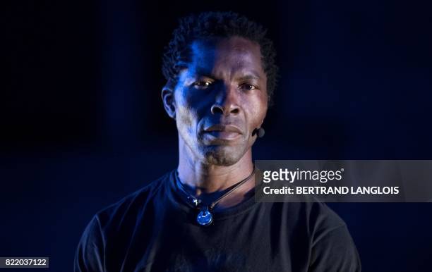 Ivorian actor Isaac de Bankole performs during a rehearsal of 'Femme Noire' on July 24, 2017 at the "Cour d'Honneur du Palais des Papes" in Avignon,...