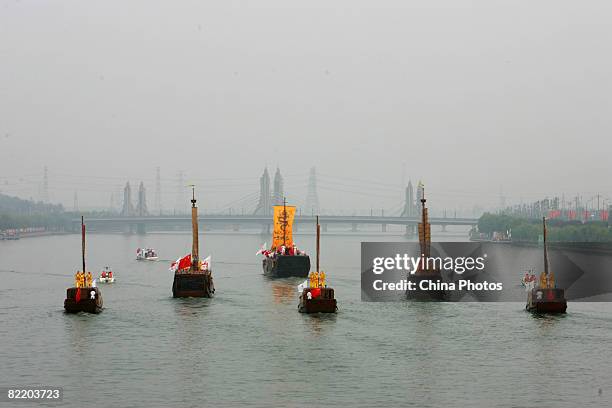 Olympic torch relay proceeds via classic imperial dragon boats on the Jing-Hang Grand Canal during the second day of the Beijing leg of Olympic torch...