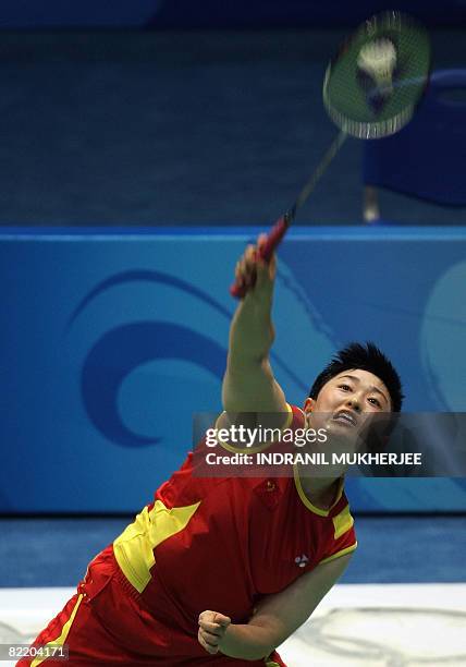 Badminton player Yu Yang of China hits a shot during a training session at the Beijing University of Technology Gymnasium in Beijing on August 07,...