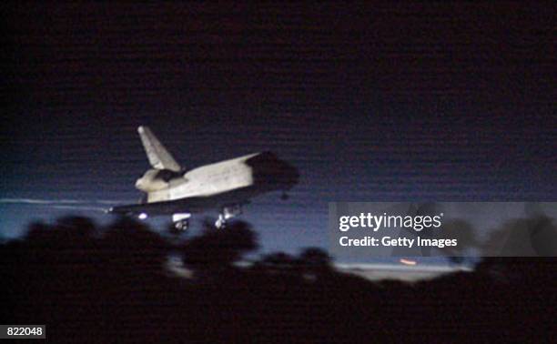 Space Shuttle Discovery prepares to land at the shuttle landing facility March 21, 2001 at Kennedy Space Center, FL. The landing concluded mission...