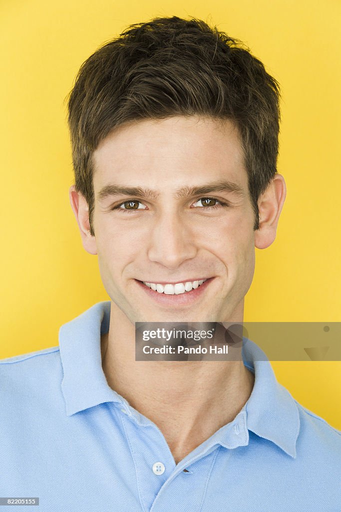 Young man smiling, portrait