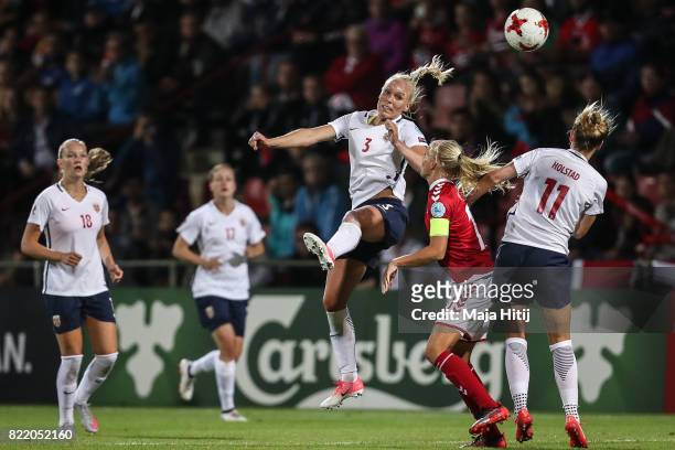 Nora Holstad Berge of Norway , Pernille Harder of Denmark and Maria Thorisdottir of Norway battle for the ball during the Group A match between...