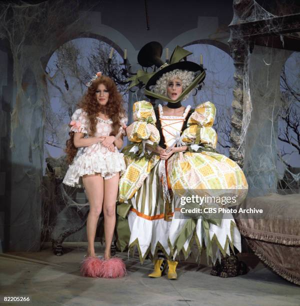 American actress/singers Bette Midler and Cher appear in elaborate costumes in a skit on the television variety show 'The Sonny & Cher Comedy Hour,'...