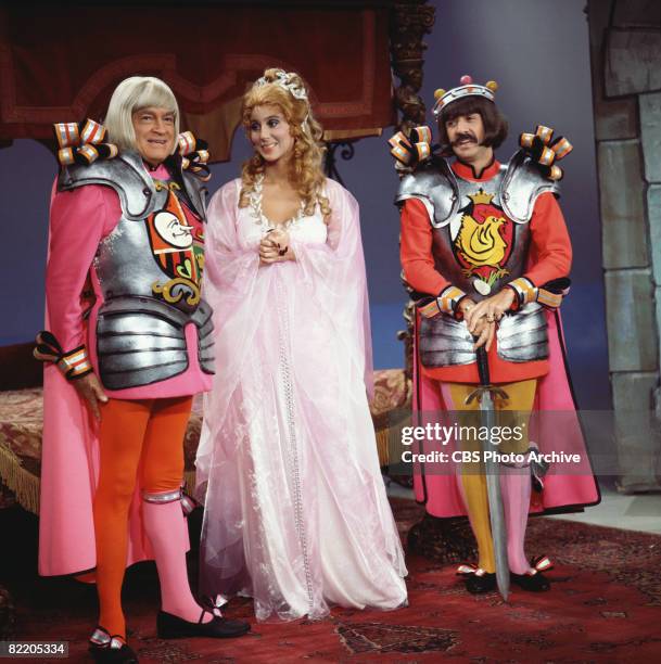 Married American singing and acting duo Cher and Sonny Bono appear with British-born American comedian and actor Bob Hope in mock-Medieval garb,...