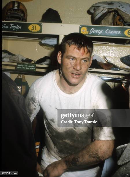 Mud-drenched Jerry Kramer, guard for the Green Bay Packers, talks to reporters following the NFL Championship Game, a 23-12 victory over the...