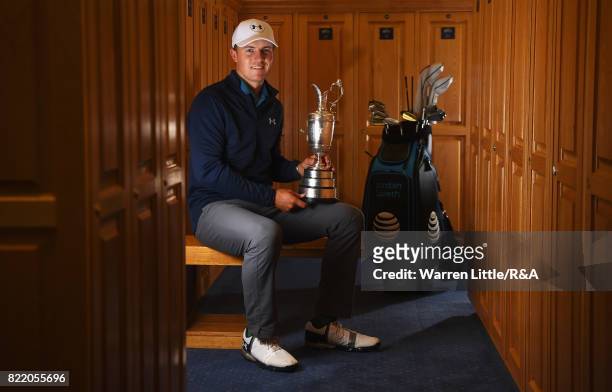 Jordan Spieth of the United States holds the Claret Jug in the locker room after winning the 146th Open Championship at Royal Birkdale on July 23,...