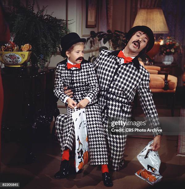 American singer and actor Sonny Bono performs in a skit with his daughter, Chastity, the pair of them dressed in matching black and white houndstooth...