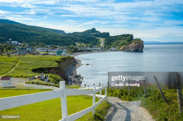 coast of gaspe peninsula at perce, quebec, canada with blue waters of the gulf of st. lawrence - gaspe peninsula stock pictures, royalty-free photos & images
