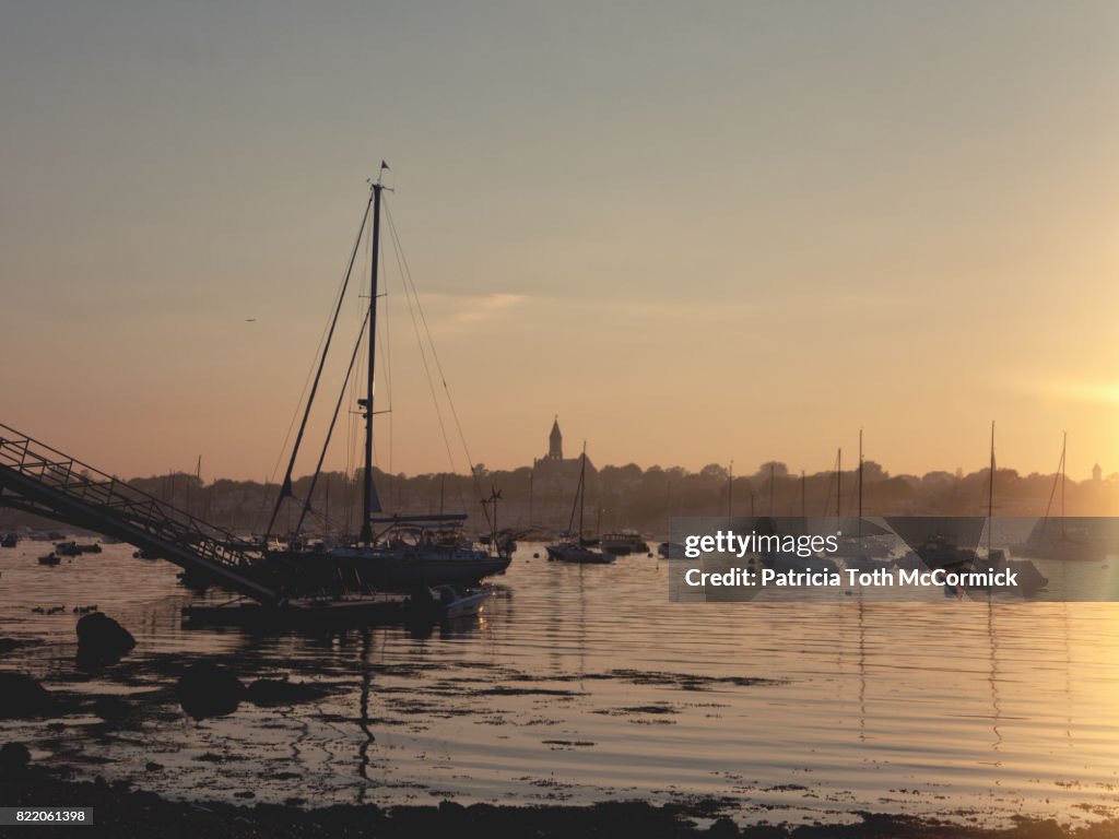 Sailboat Silhouetted at Sunset