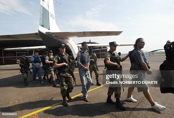 Group of Lebanese drug traffickers arrested on the eve in Ciudad del Este, Paraguay, are shown under custody on August 7, 2008 at Asuncion's airport...