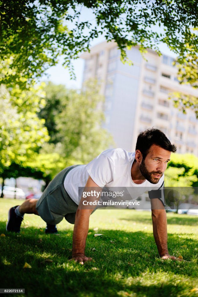 Young man doing pushups