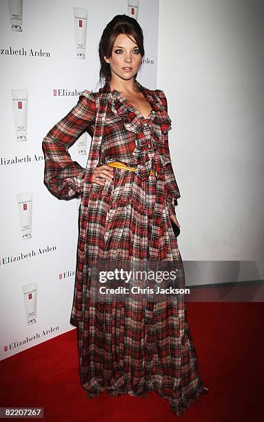 Natalie Dormer arrives with a friend at the Elizabeth Arden 'Eight Hour Party' at 24 Kingly Street on August 7, 2008 in London, England.