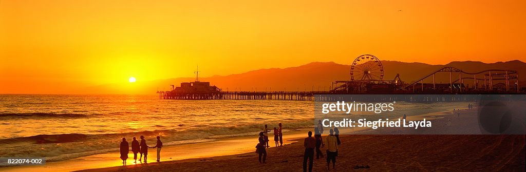 USA, California, Santa Monica Pier and beach at sunset