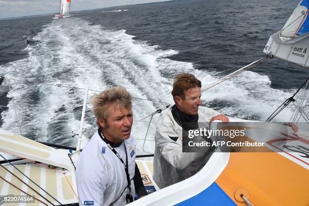 French Skipper Yann Elies and French skipper Jean-Pierre Dick helm their class Imoca 60 monohull StMichel-Virbac during a training session off the...