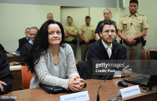 Beate Zschaepe, the main defendant in the marathon NSU neo-Nazi murder trial sits next to her lawyer Mathias Grasel in court on the day federal...