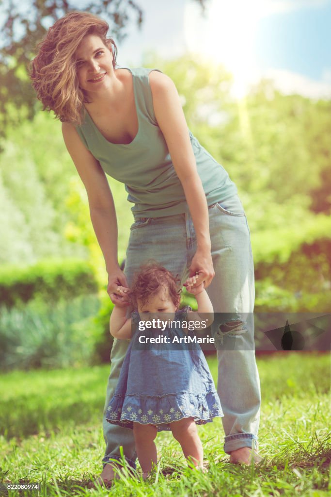 Mother and her baby daughter in park