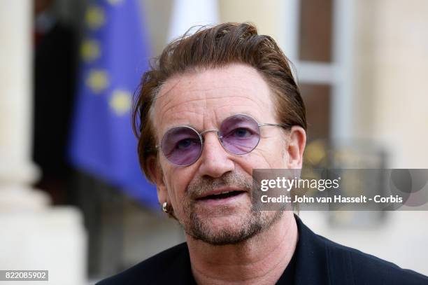 Singer-songwriter and philanthropist Bono speaks to media after attending a meeting with French President Emmanuel Macron at the Elysée Palace on...