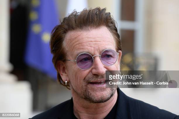 Singer-songwriter and philanthropist Bono speaks to media after attending a meeting with French President Emmanuel Macron at the Elysée Palace on...