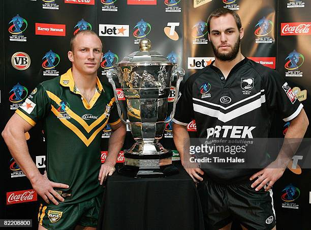 Darren Lockyer captain of the Australian Kangaroos, left, and Simon Mannering of the New Zealand Kiwis pose with the Rugby League World Cup trophy...