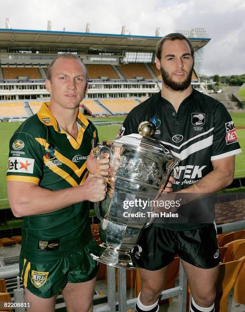 Darren Lockyer captain of the Australian Kangaroos, left, and Simon Mannering of the New Zealand Kiwis pose with the Rugby League World Cup trophy...