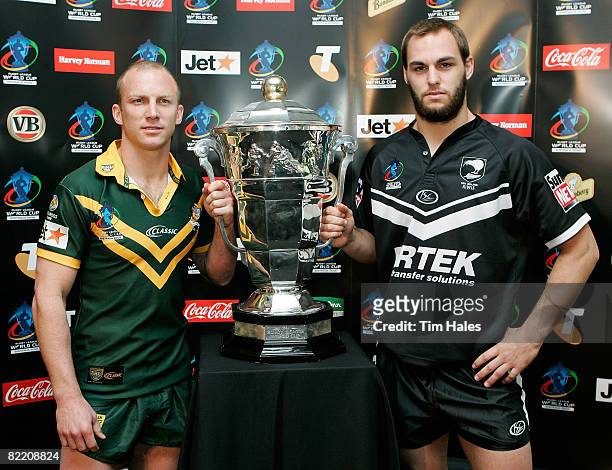 Darren Lockyer captain of the Australian Kangaroos and Simon Mannering of the New Zealand Kiwis pose with the Rugby League World Cup trophy a Rugby...