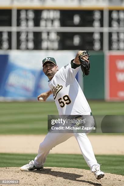 Andrew Brown of the Oakland Athletics pitches during the game against the San Francisco Giants at McAfee Coliseum in Oakland, California on June 29,...