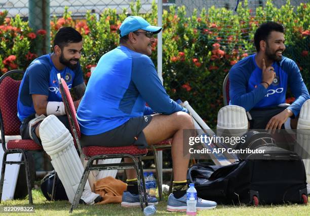 Indian cricket team captain Virat Kohli , Rohit Sharma and newly-appointed coach Ravi Shastri take part in a practice session at Galle International...