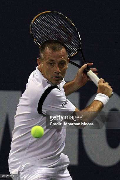 Mikael Pernfors of Sweden returns to John McEnroe during day four of the Countrywide Classic at the Los Angeles Tennis Center-UCLA on August 7, 2008...