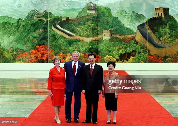 President George W. Bush and First Lady Laura Bush pose with Chinese President Hu Jintao and his wife Liu Yongqing before a welcome banquet at the...