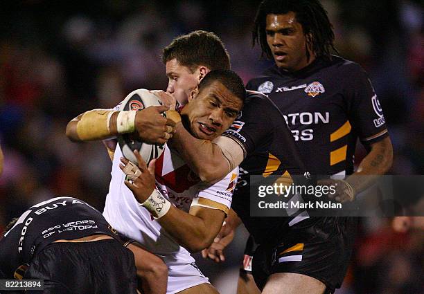 Nolan Stringer Lagi Setu of the Dragons is tackled during the round 22 NRL match ...