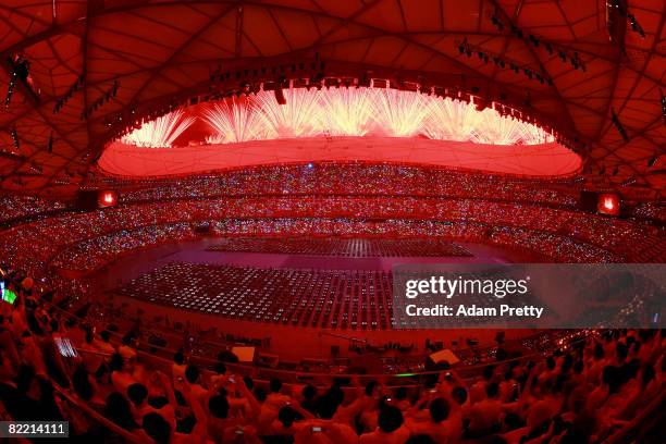 Fireworks explode from the stadium roof during the Opening Ceremony for the 2008 Beijing Summer Olympics at the National Stadium on August 8, 2008 in...