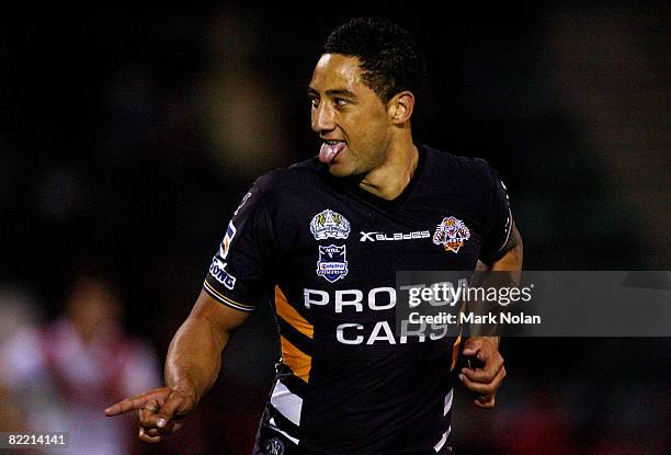 Benji Marshall of the Tigers celebrates after kicking a goal during the round 22 NRL match between the St George-Illawarra Dragons and the Wests...