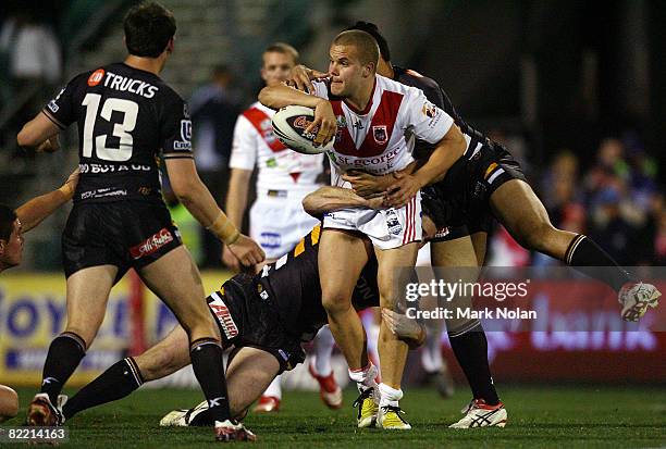 Nolan Stringer Dan Hunt of the Dragons looks to offload as he is tackled during the ...