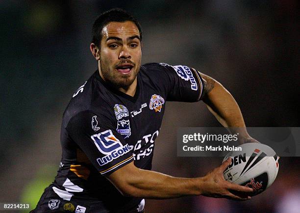 Dene Halatau of the Tigers looks to pass during the round 22 NRL match between the St George-Illawarra Dragons and the Wests Tigers at WIN Stadium on...