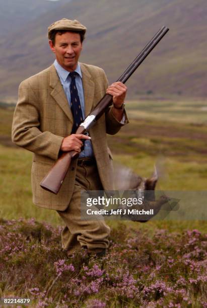 Ian McColl, director of the Game and Conservation Trust, watches a grouse on the Railia and Milton Estate August 8, 2008 in Scotland. As the glorious...